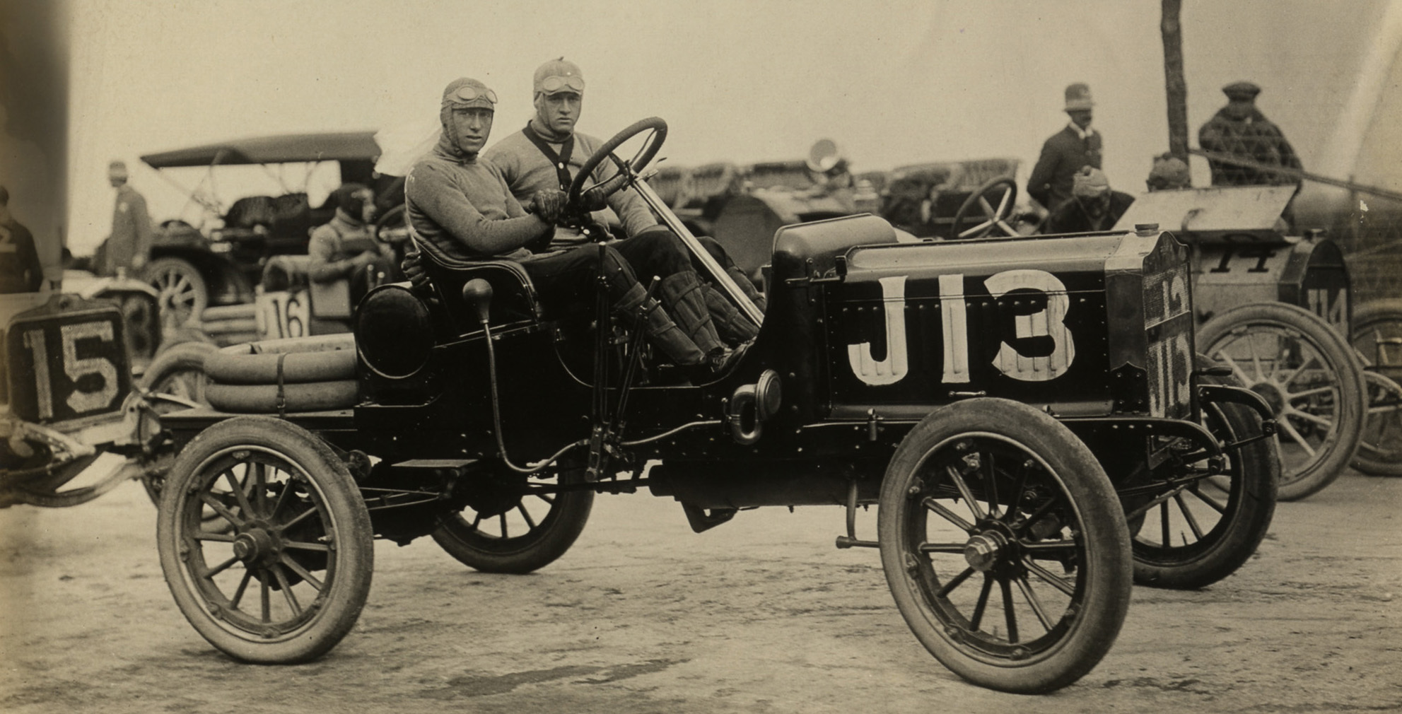 Driver and passenger in Maxwell racecar