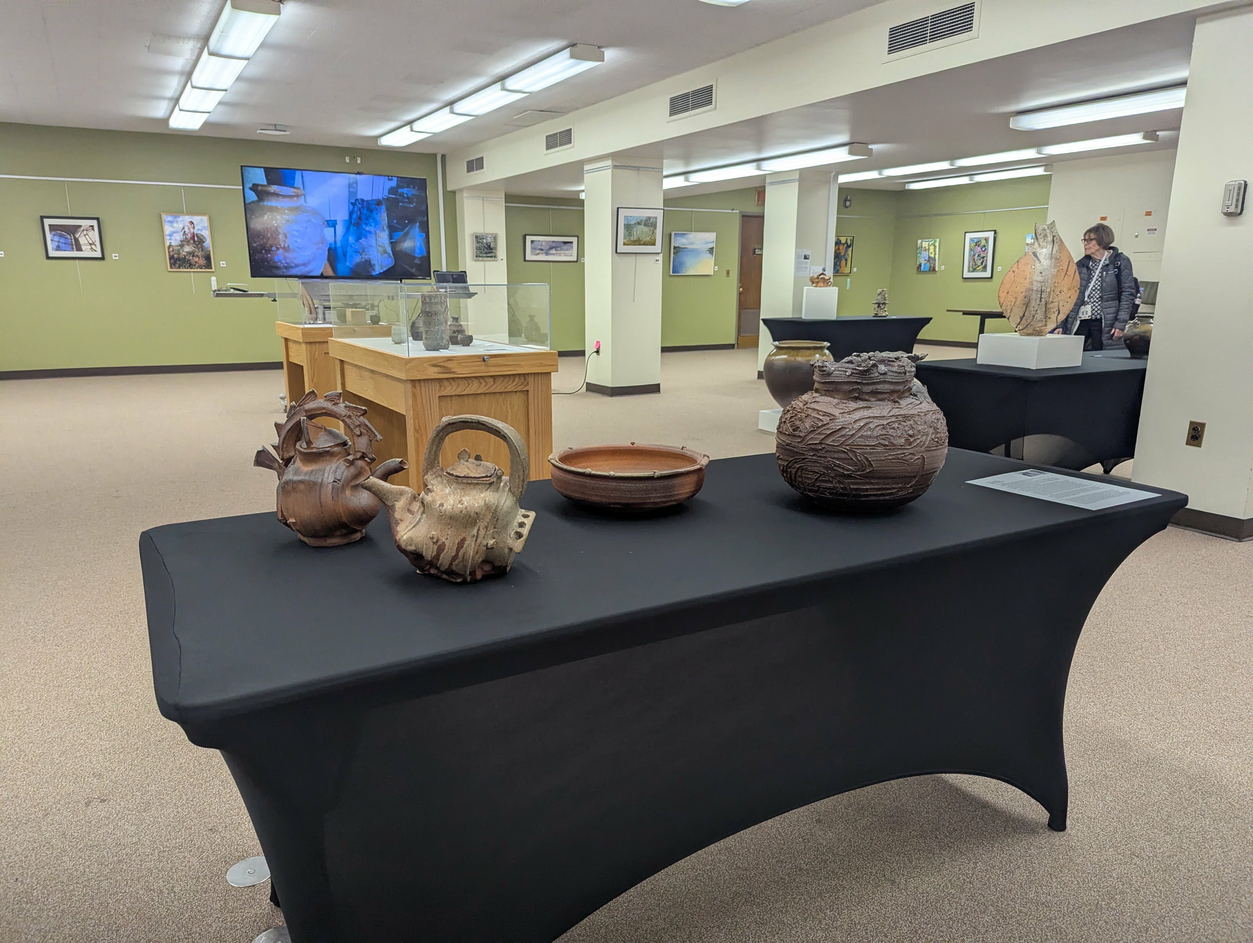 Ceramics sit on tables in the Main Library Galleria.